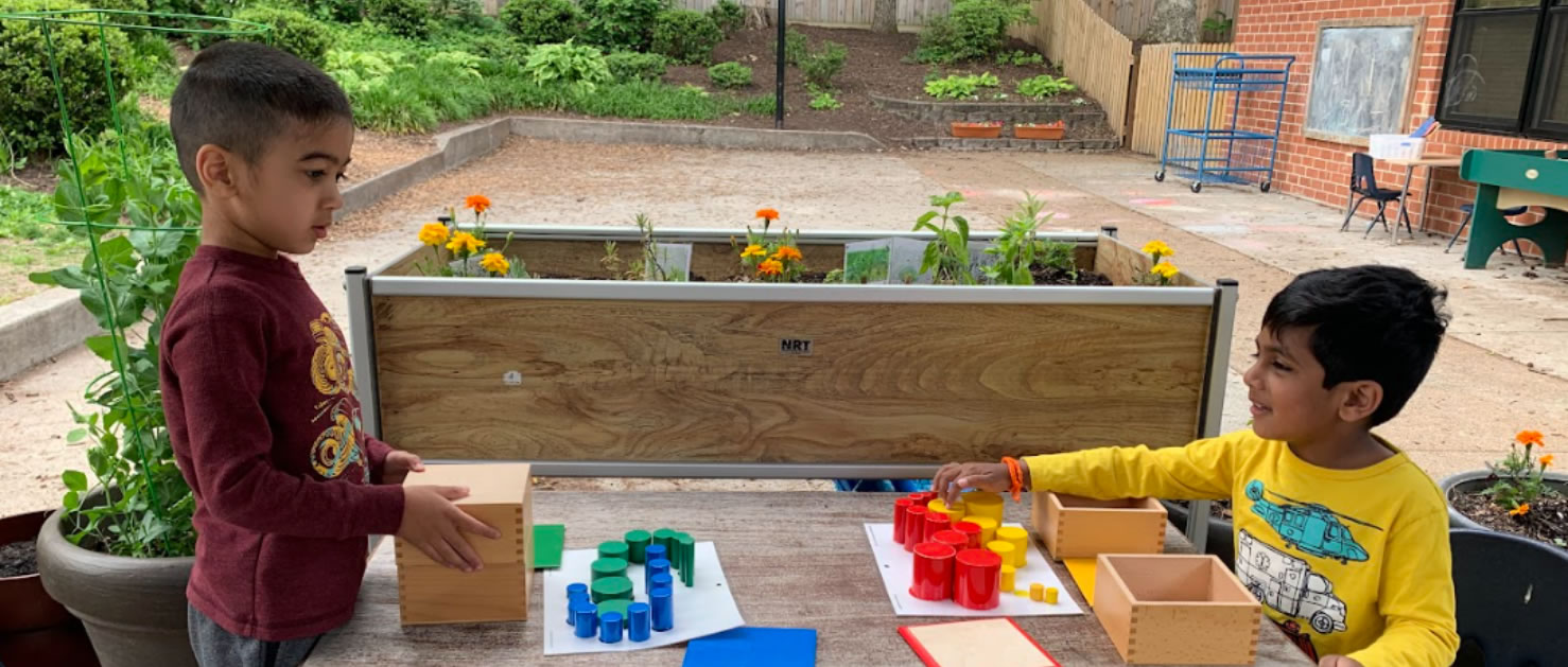 Children playing with colored cylinder blocks of varies sizes