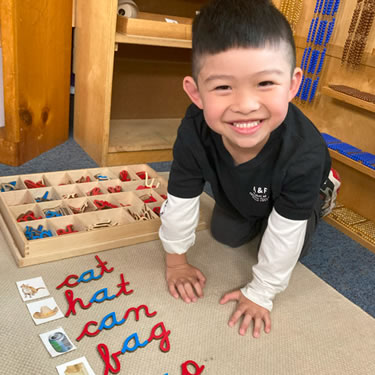 Toddlers playing with letters