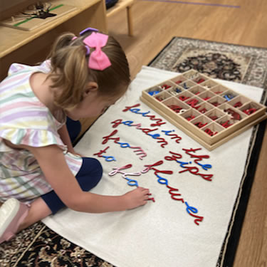 Child playing with letters